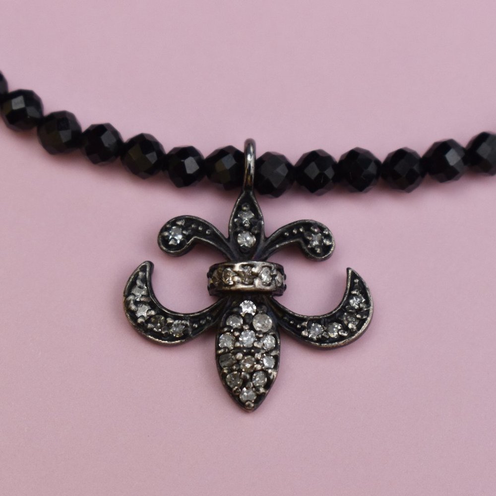 Tiny black spinel choker necklace with fleur de lis charm
